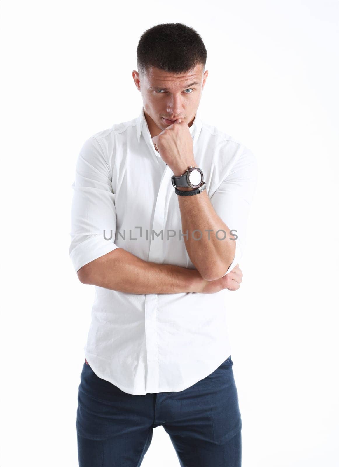 Young successful businessman on a white background in a shirt