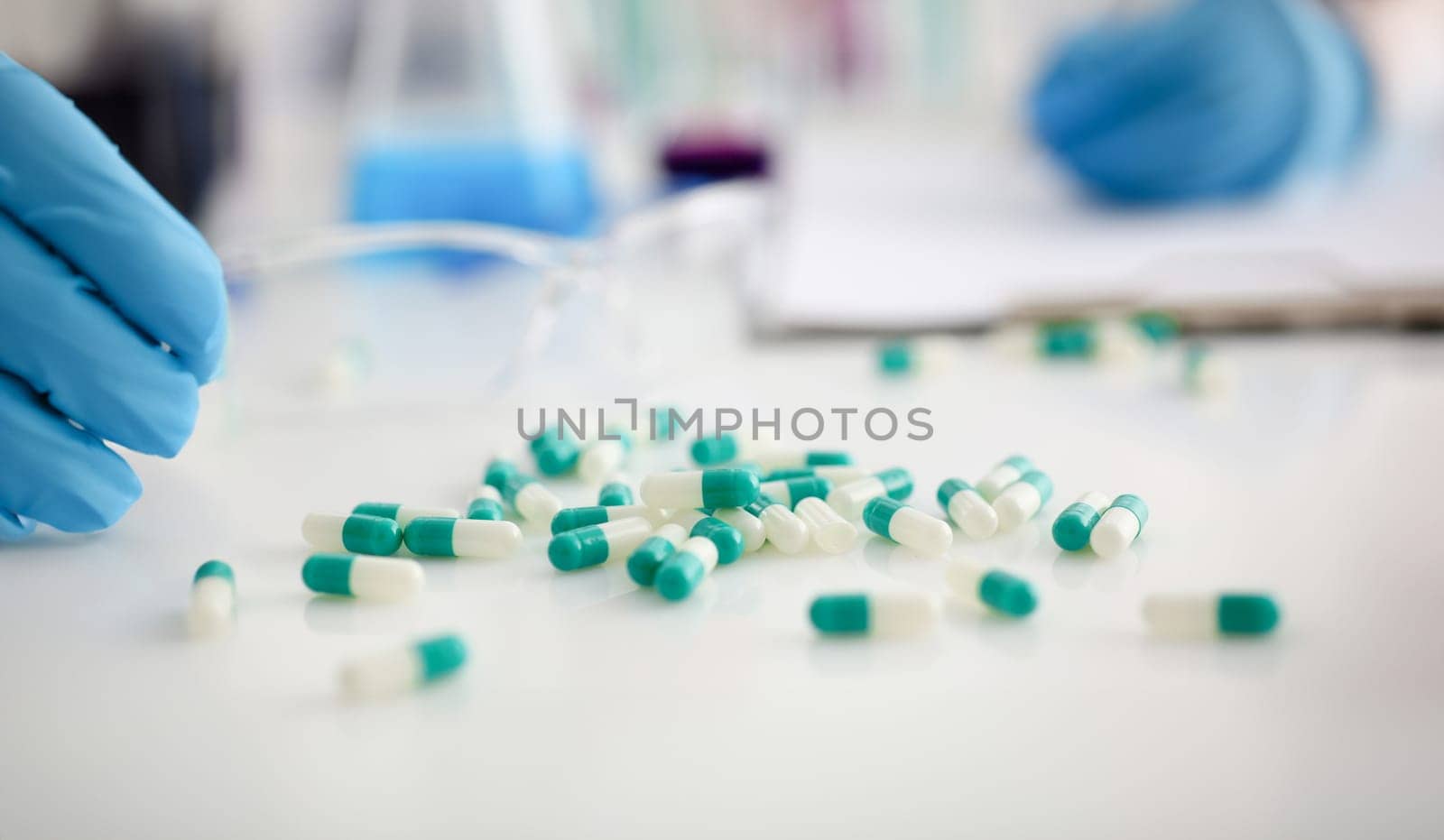 Tablets scattered on the table of the pharmaceutical laboratory pill for the prescription and treatment of various diseases chemistry