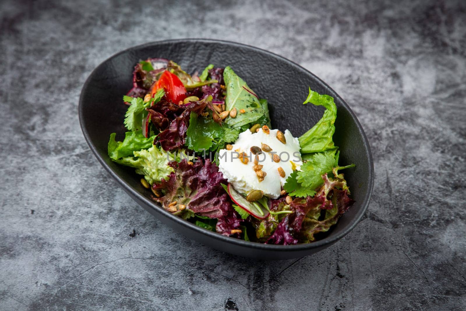 fresh salad with herbs and cherry tomatoes