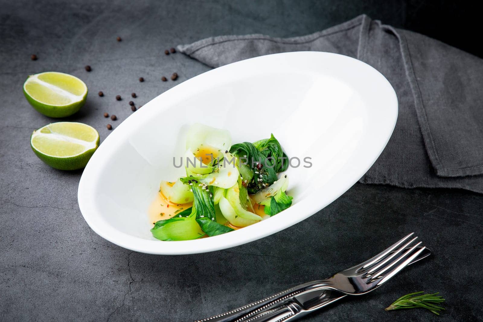 a dish of eggs and seaweed with sesame seeds and lime on the background