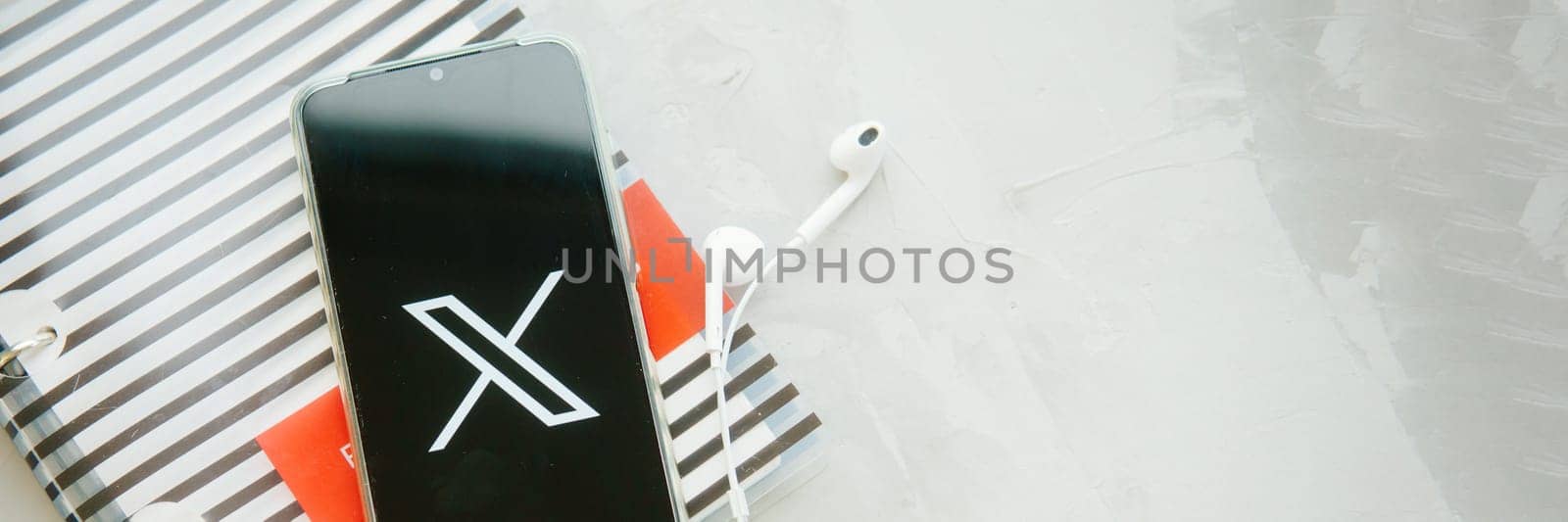 July 25, 2023, Russia. The logo in the form of the letter X displayed on the smartphone. Twitter rebranding, and implementation of X