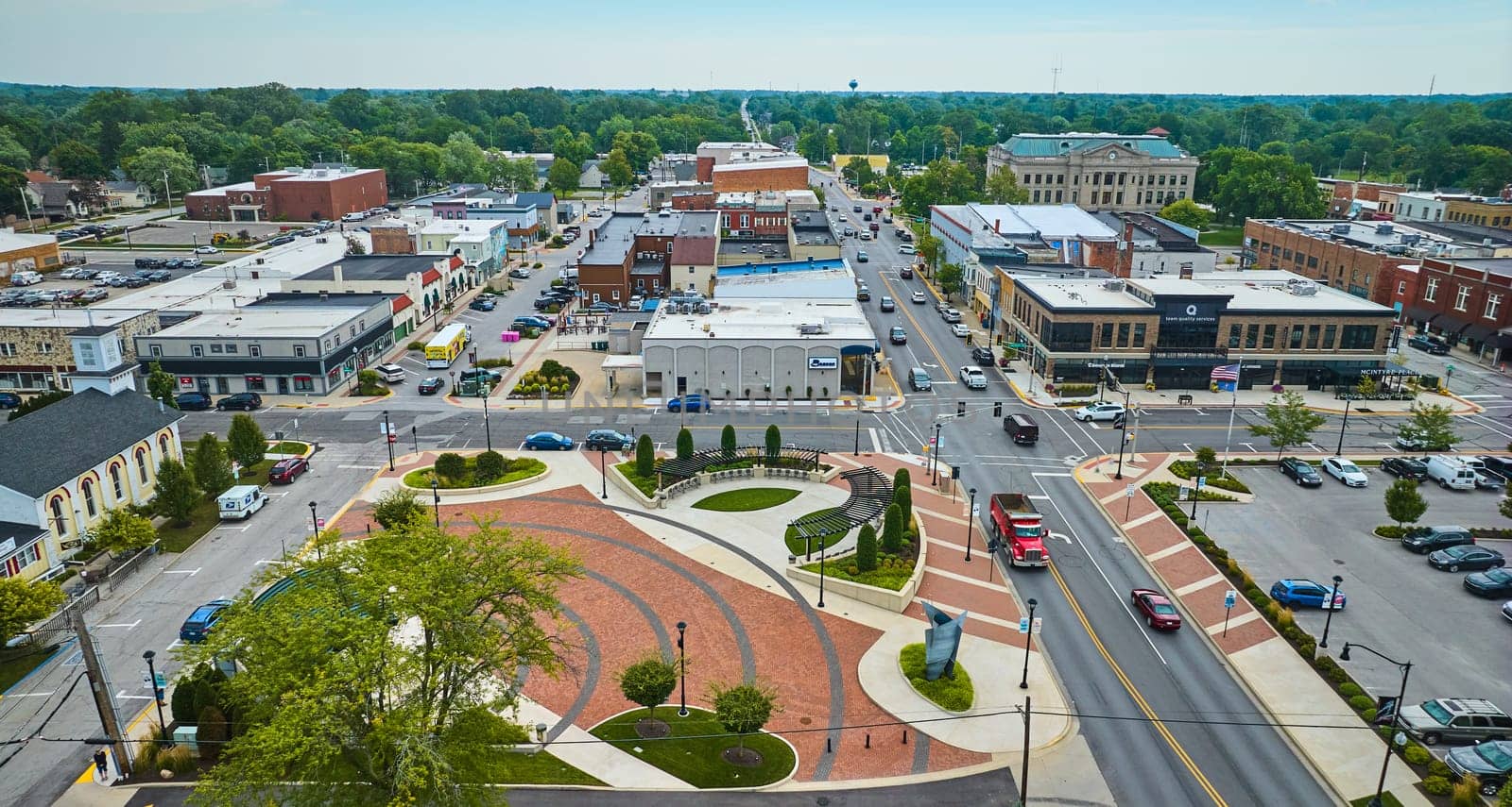 Image of James Cultural Plaza with distant courthouse in downtown Auburn aerial