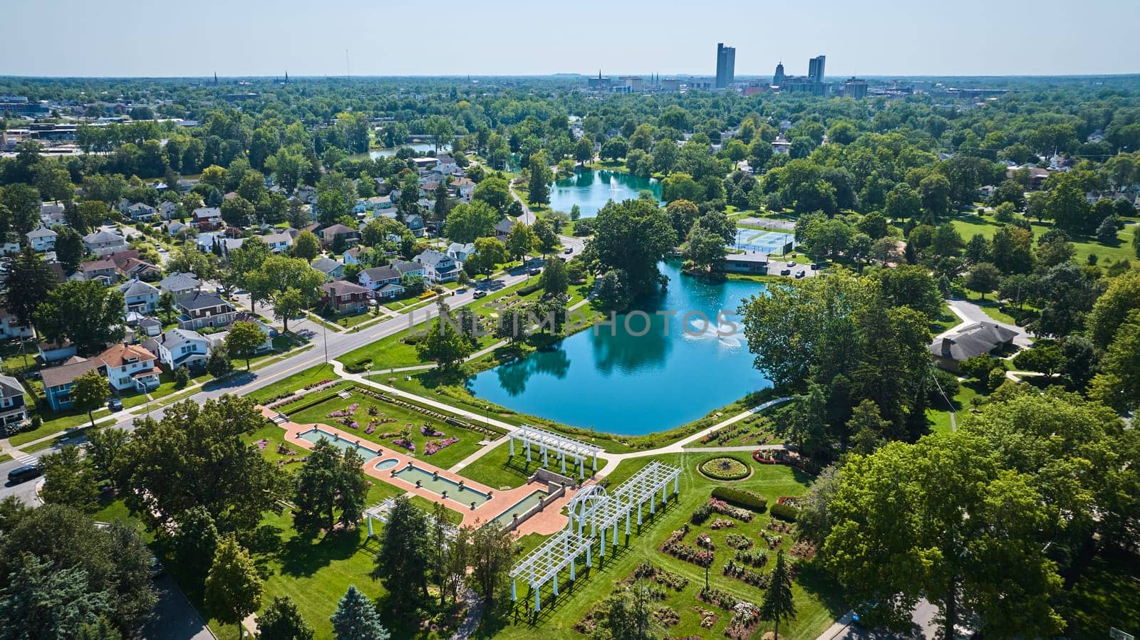 Image of Aerial Lakeside Park gardens and fountains with distant downtown Fort Wayne