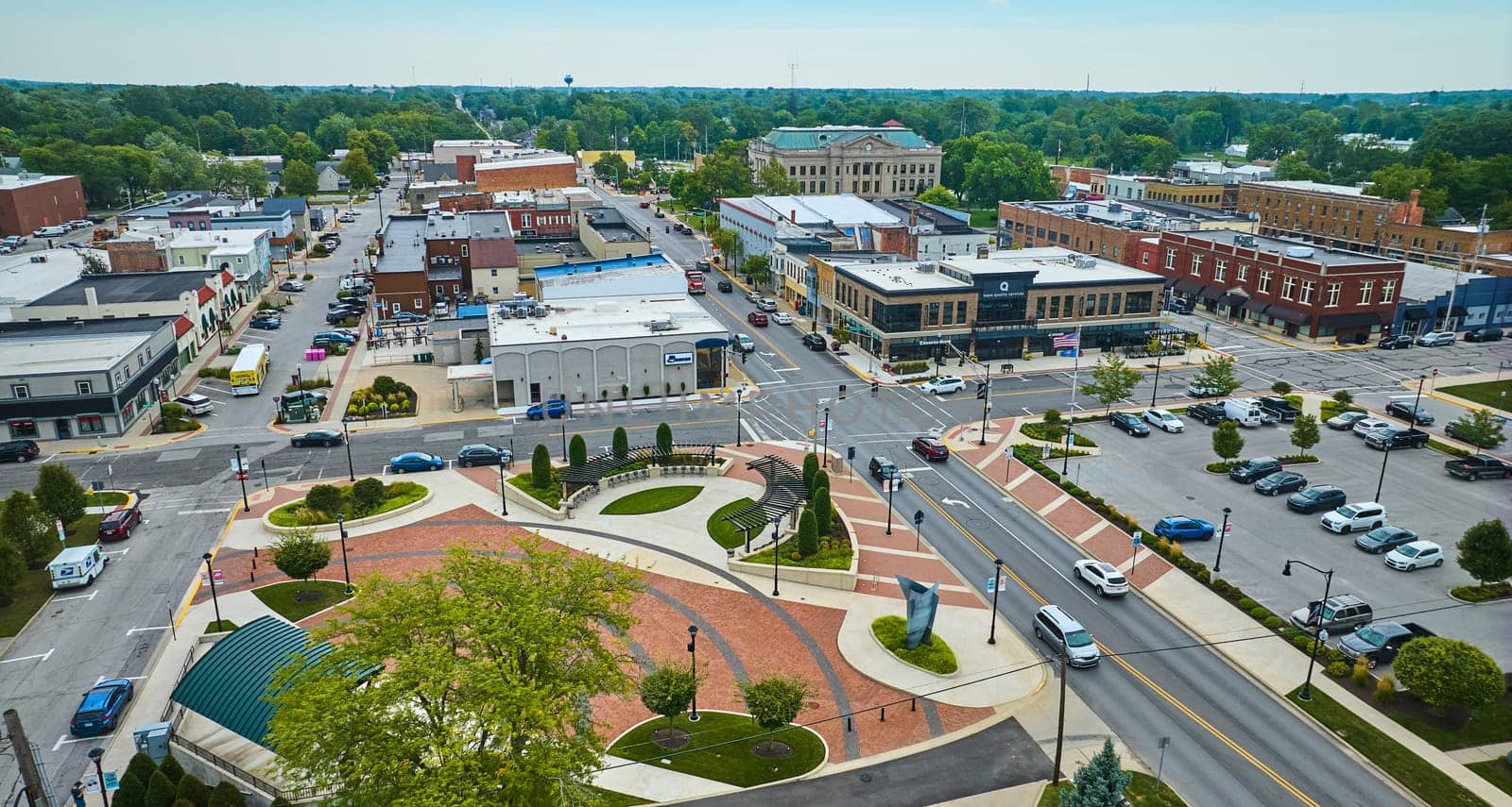 Image of Aerial with James Cultural Plaza with distant courthouse in downtown Auburn