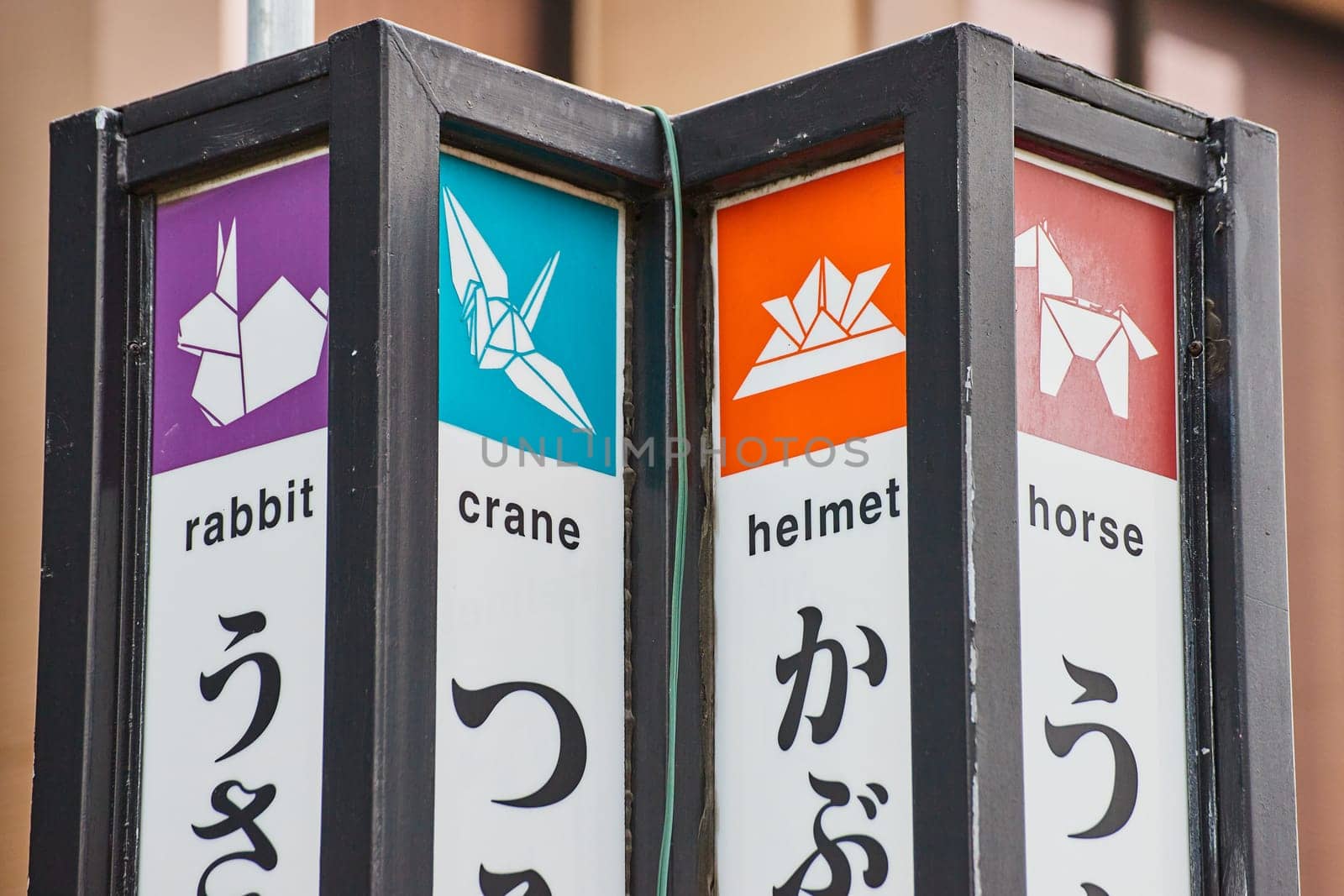 Image of Top of colorful sign in Japantown with names for the rabbit and crane with horse and helmet