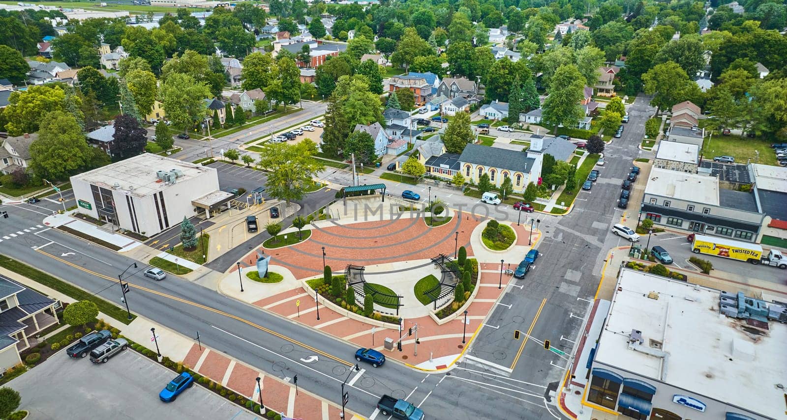Image of James Cultural Plaza aerial in Auburn with houses and church