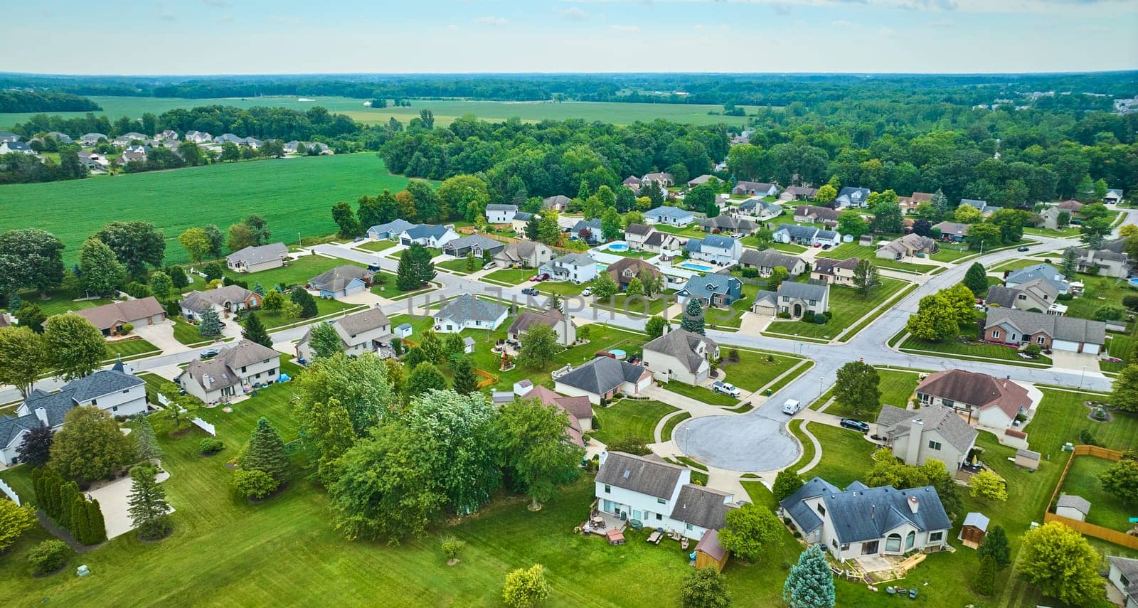 Image of Rural neighborhood with farmland between neighborhoods aerial