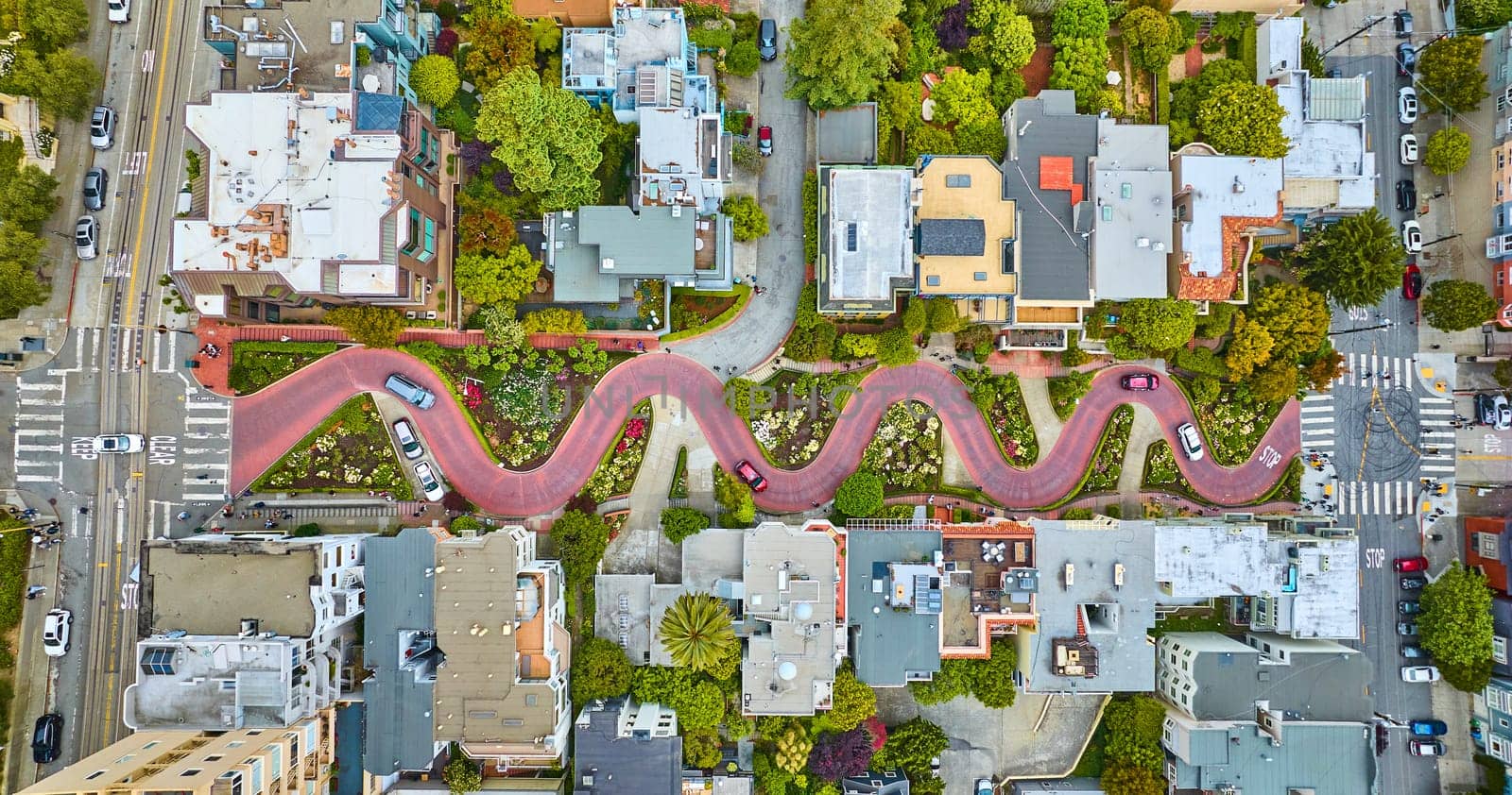 Image of Aerial straight down view Lombard Street with cars driving down red brick road