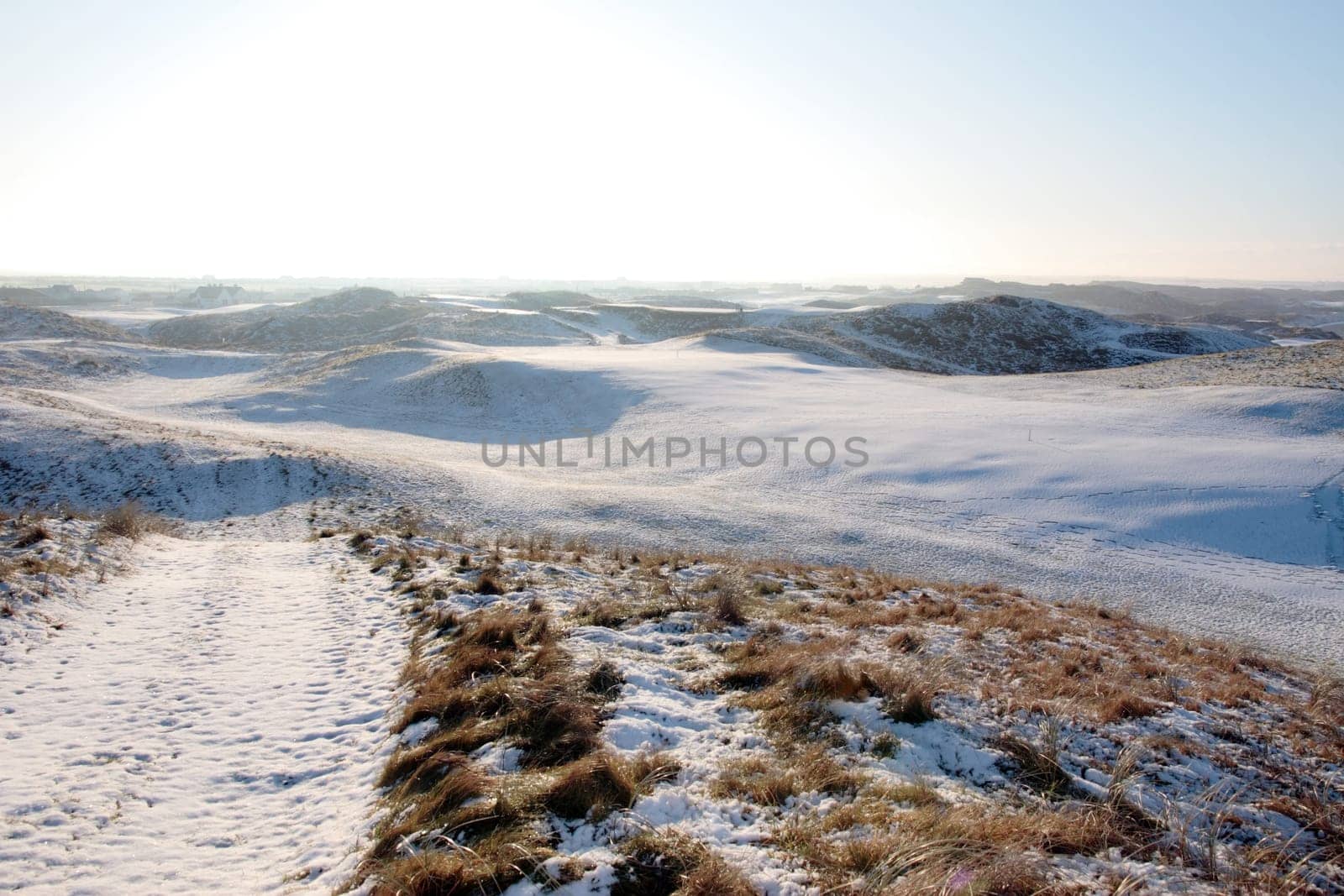 snow covered links golf course in ireland in winter