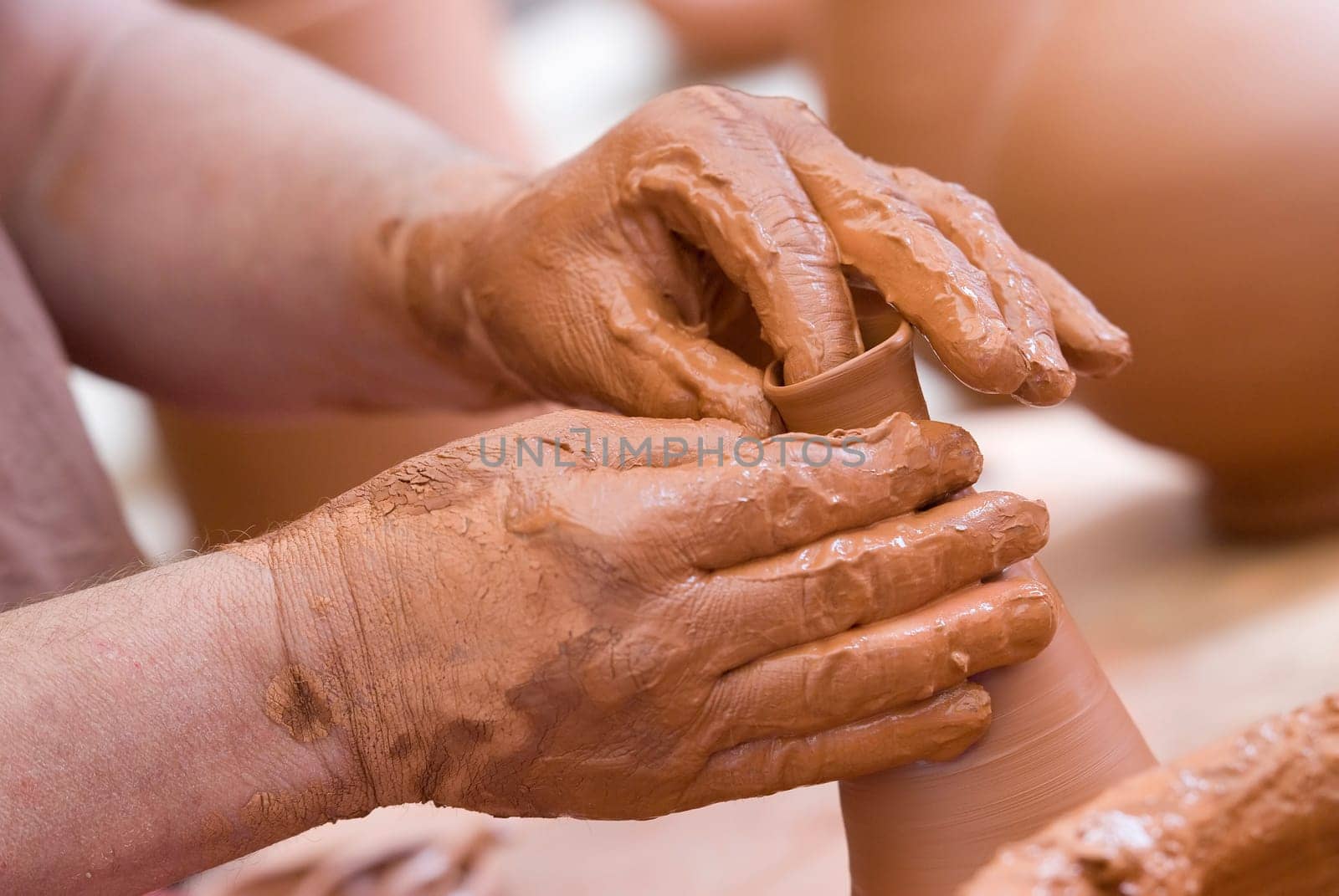 Potter working with clay.