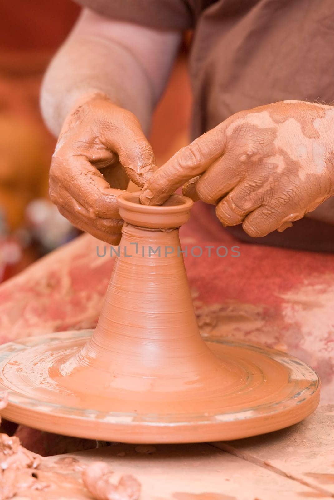 Potter working with clay.
