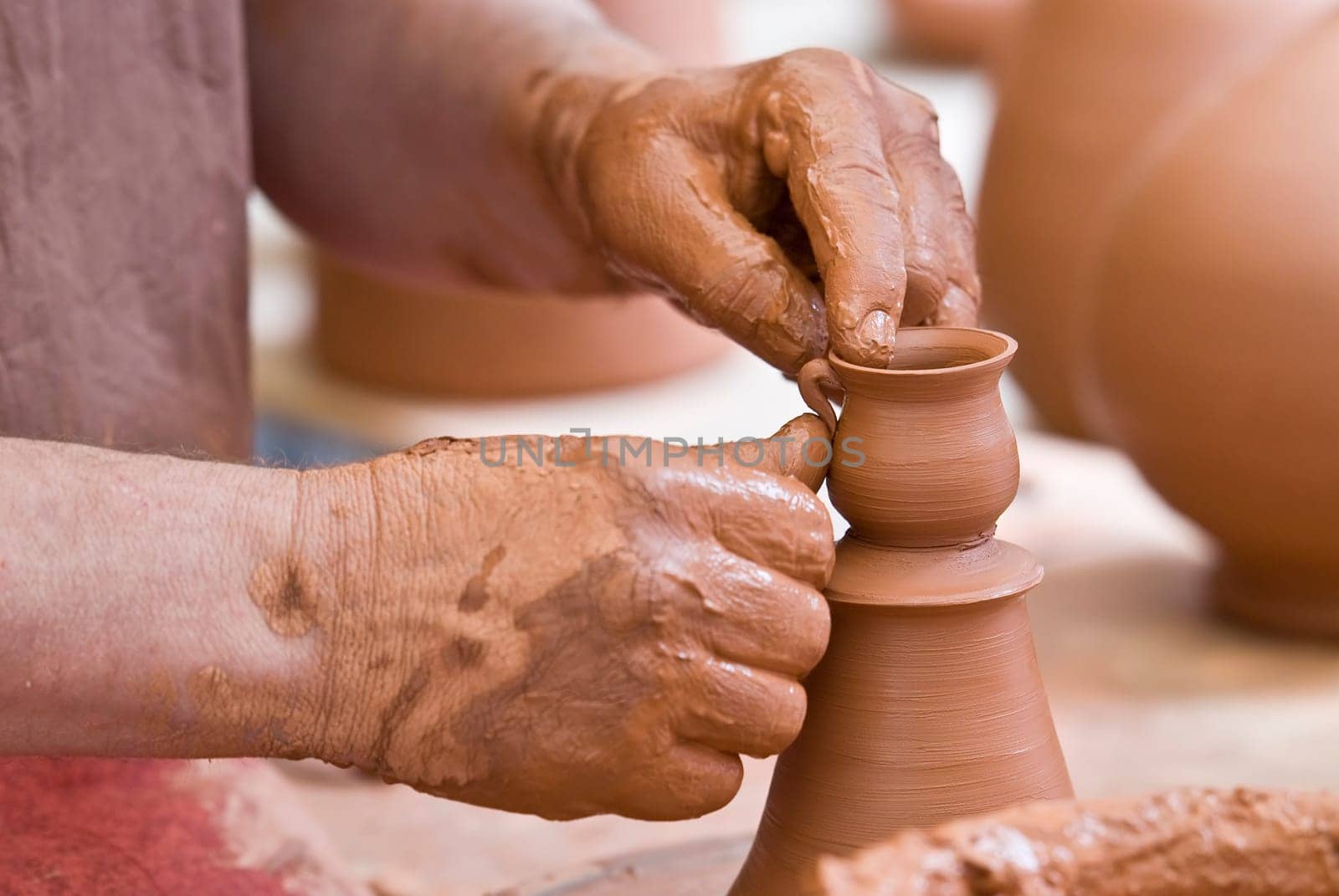 Potter working with clay.