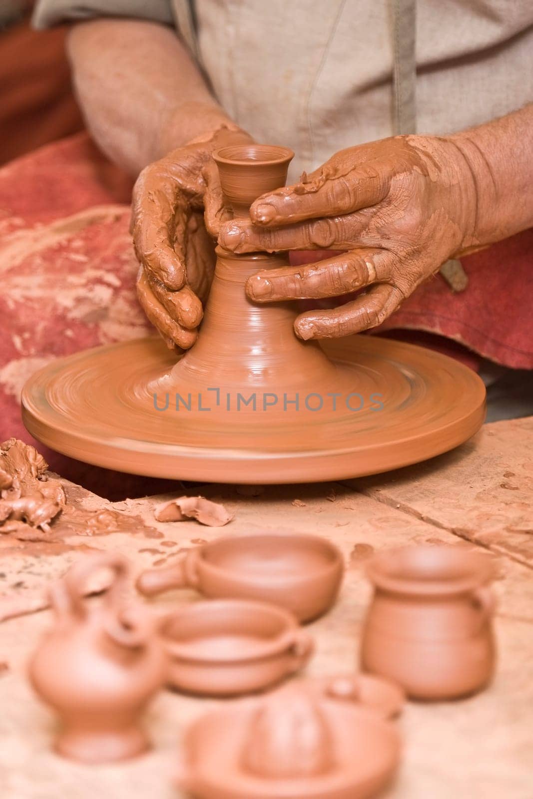 Potter working with clay.