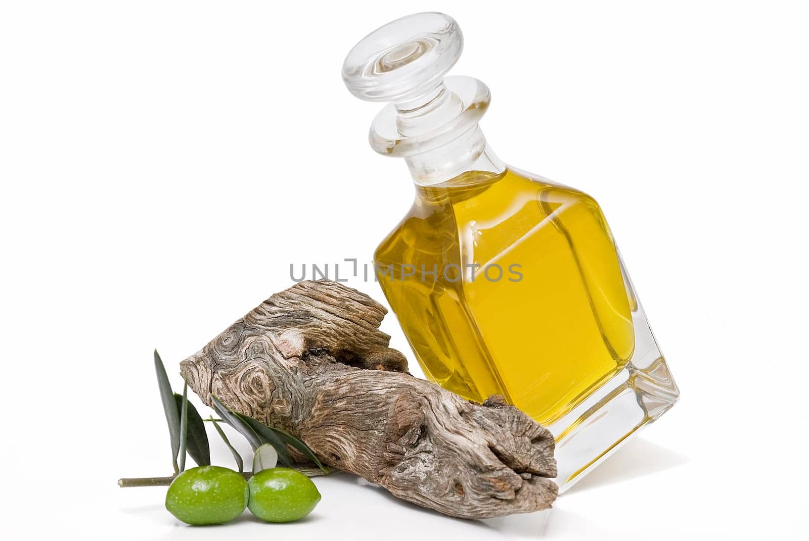 Virgin olive oil and olives isolated on a white background.
