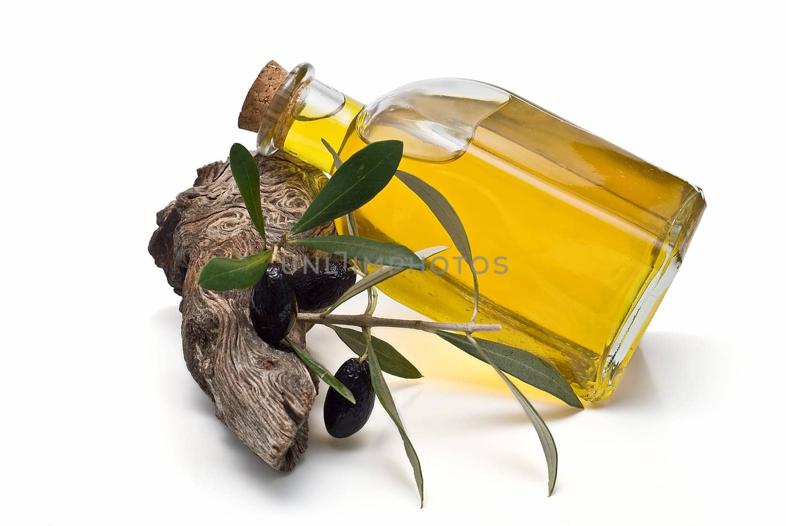 Virgin olive oil and olives isolated on a white background.