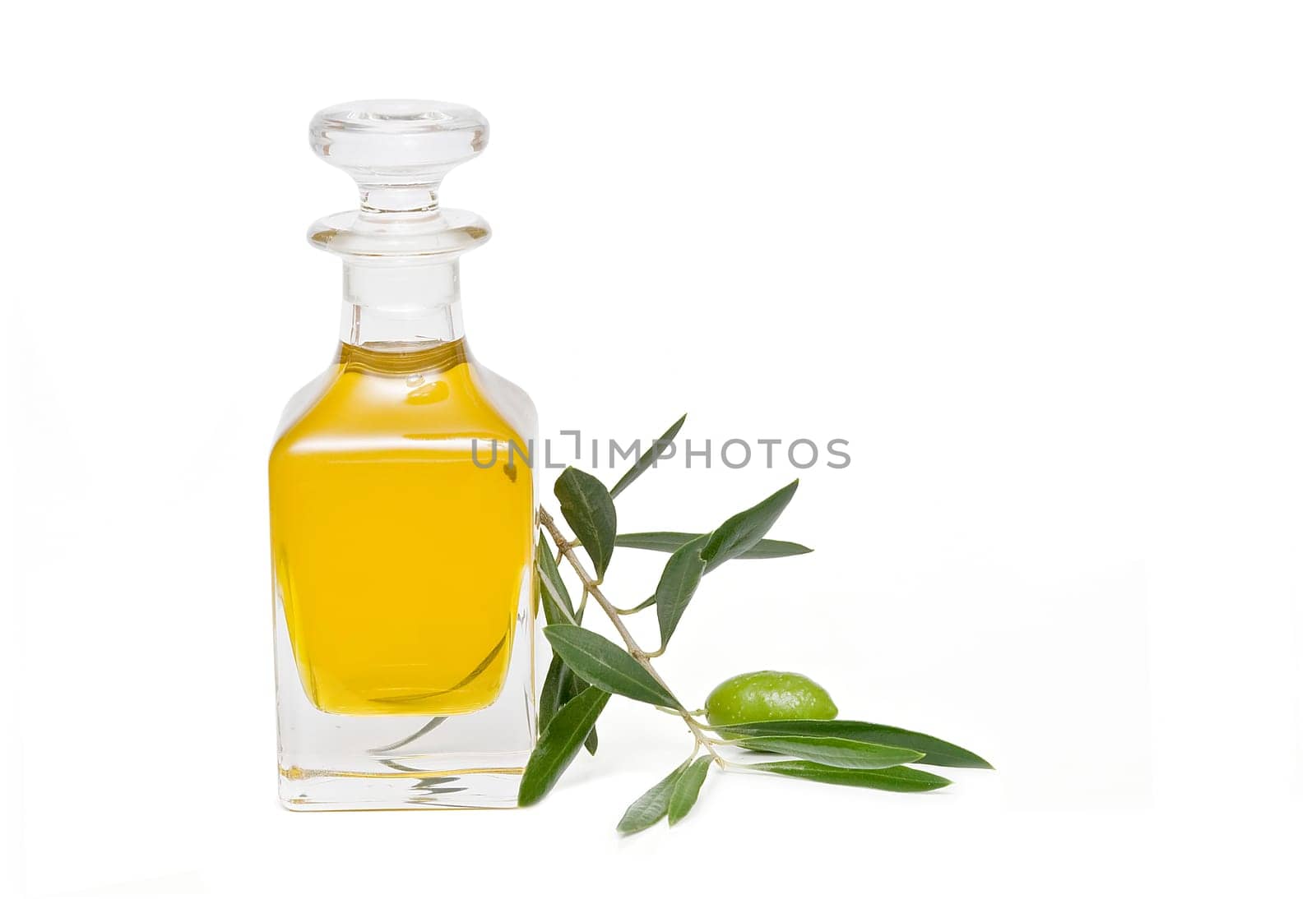 Virgin olive oil and olives isolated on a white background.