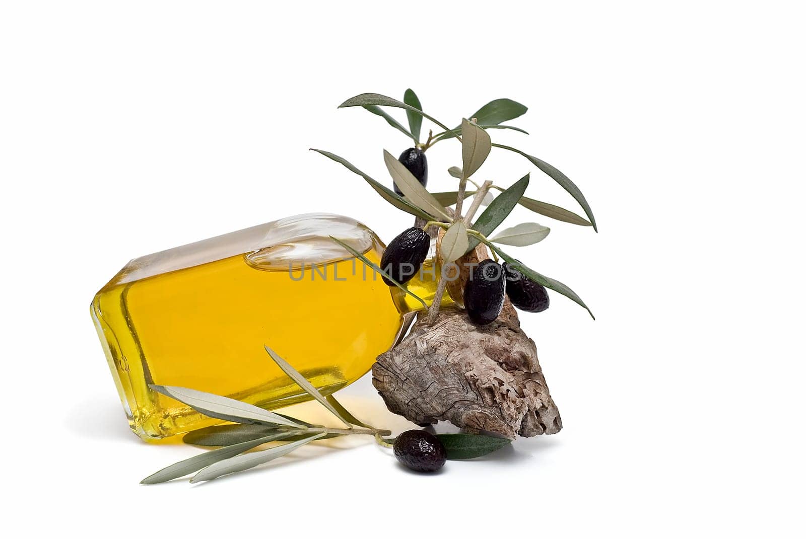 Virgin olive oil and olives isolated on a white background.