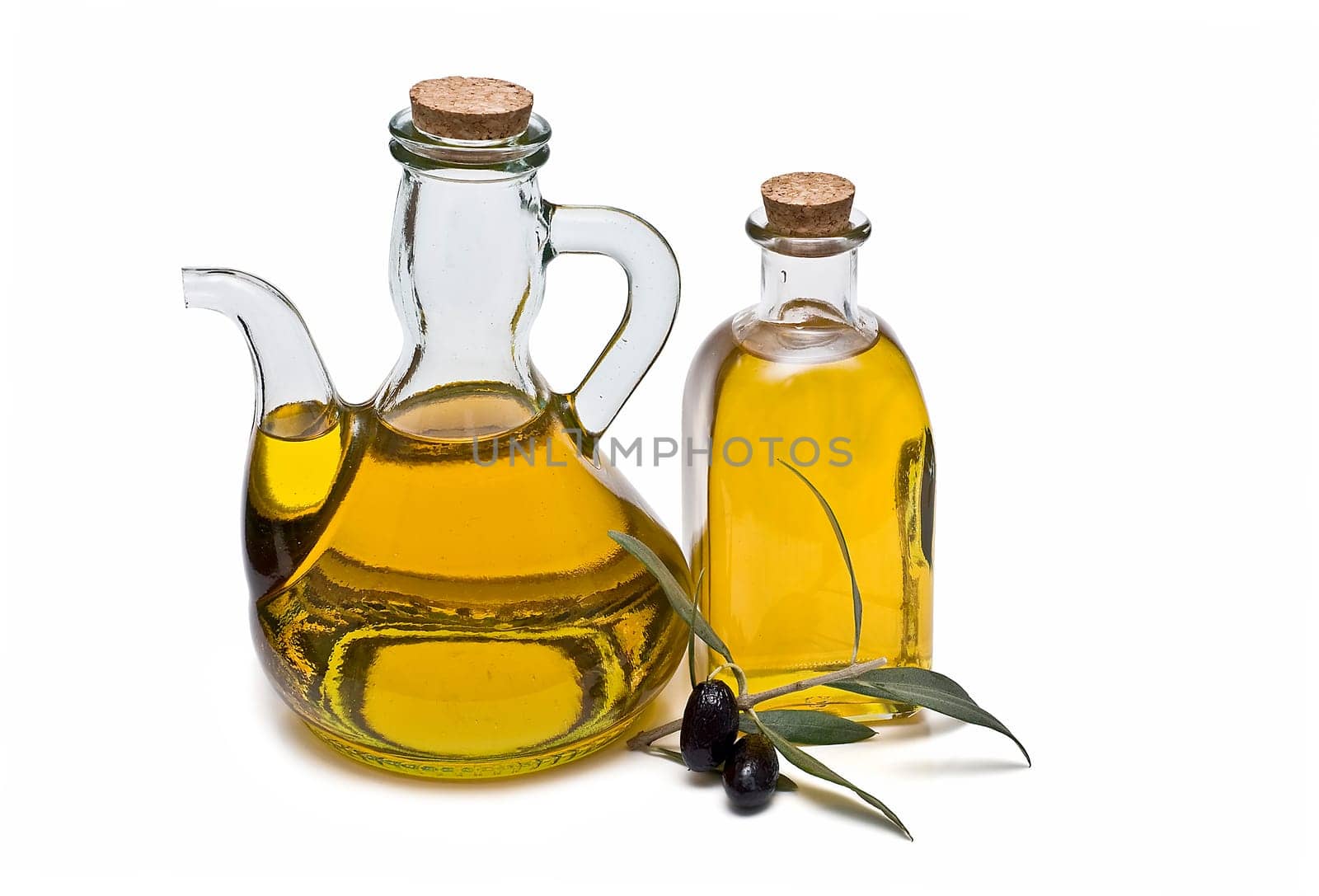 Virgin olive oil and olives isolated on a white background.