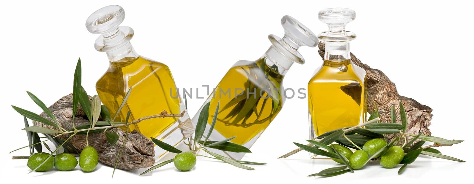 Virgin olive oil and olives isolated on a white background.