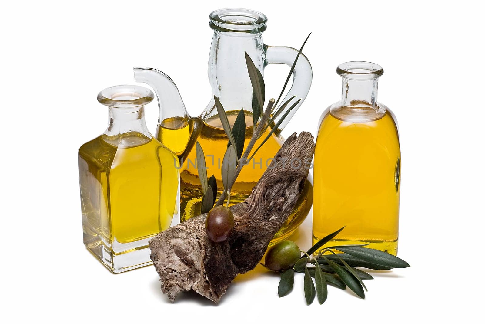 Virgin olive oil and olives isolated on a white background.