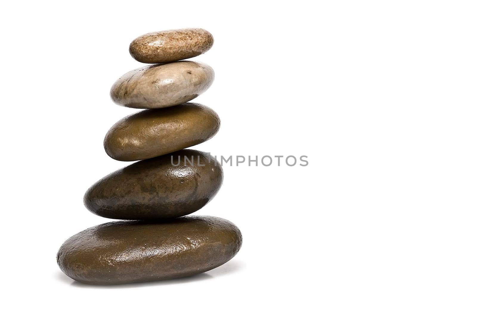 Boulders in zen balance over a white background.