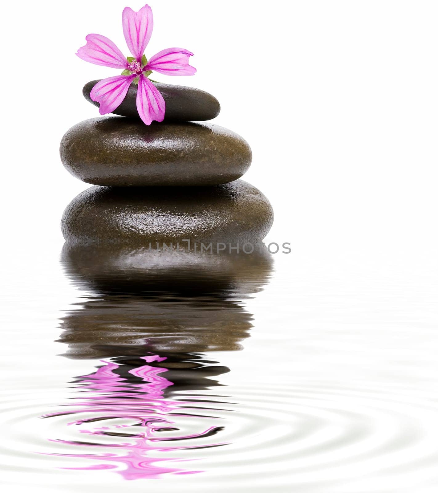 Boulders in zen balance over a white background.