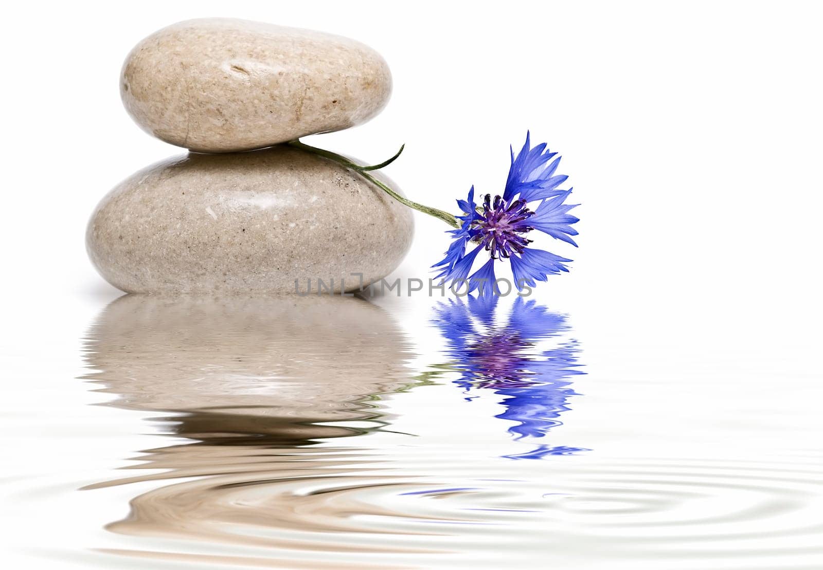Boulders in zen balance over a white background.