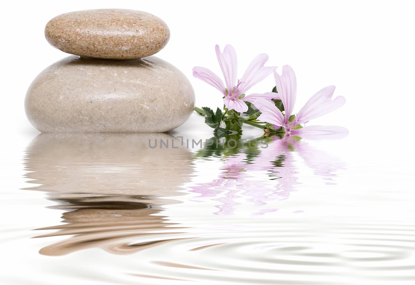 Boulders in zen balance over a white background.