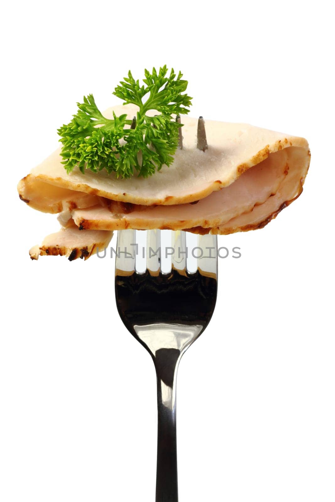 Roast pork with parsley on a fork
