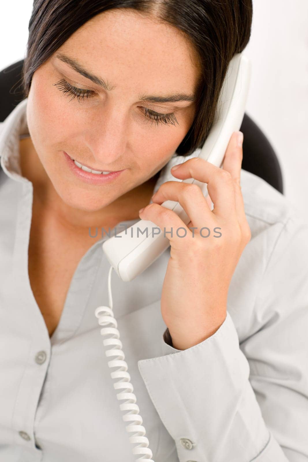 Thoughtful businesswoman attractive calling on phone close-up portrait