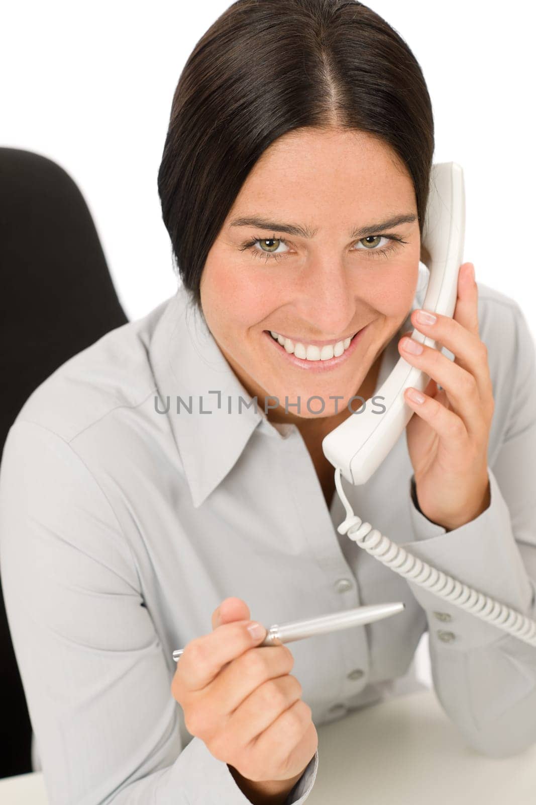 Smiling businesswoman attractive calling on phone close-up portrait