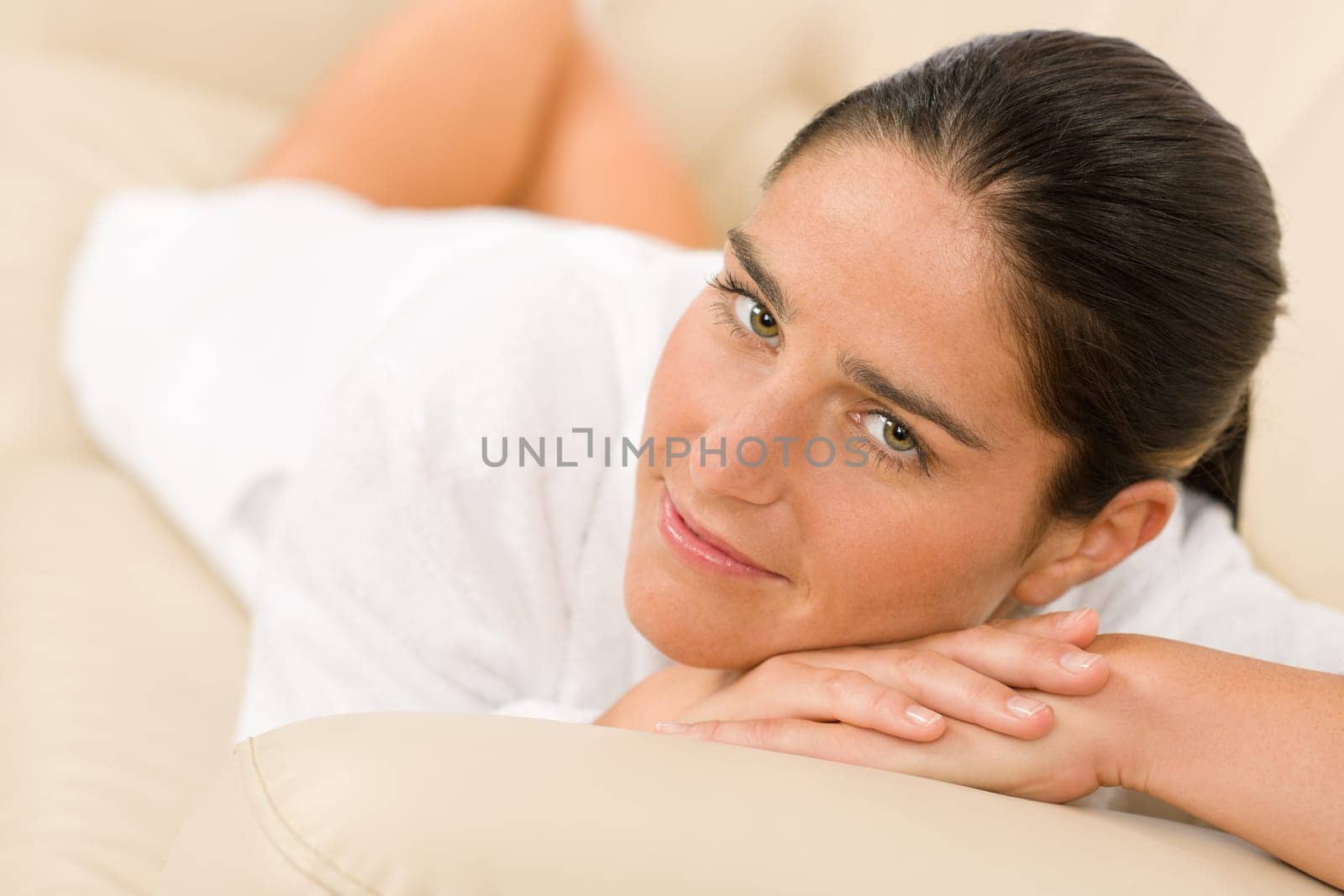 Attractive mid-aged woman facial beauty portrait looking at camera