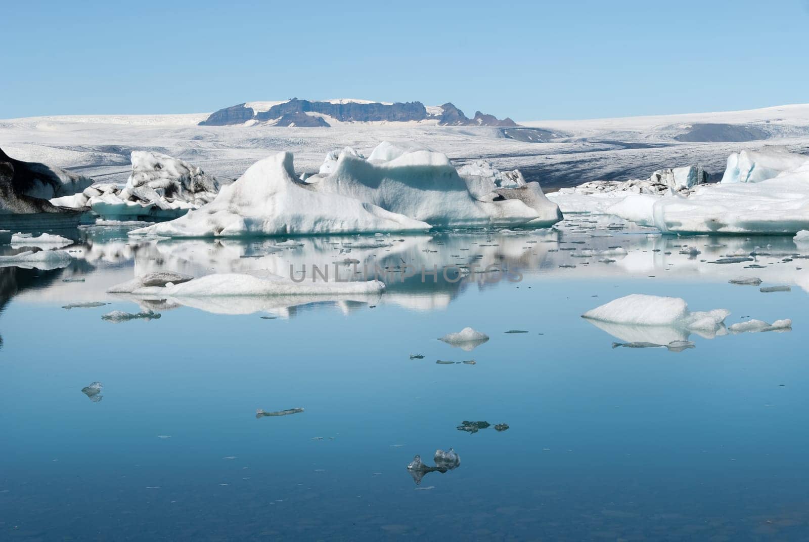 glacier reflected on the Jokulsarlon lake in Iceland
