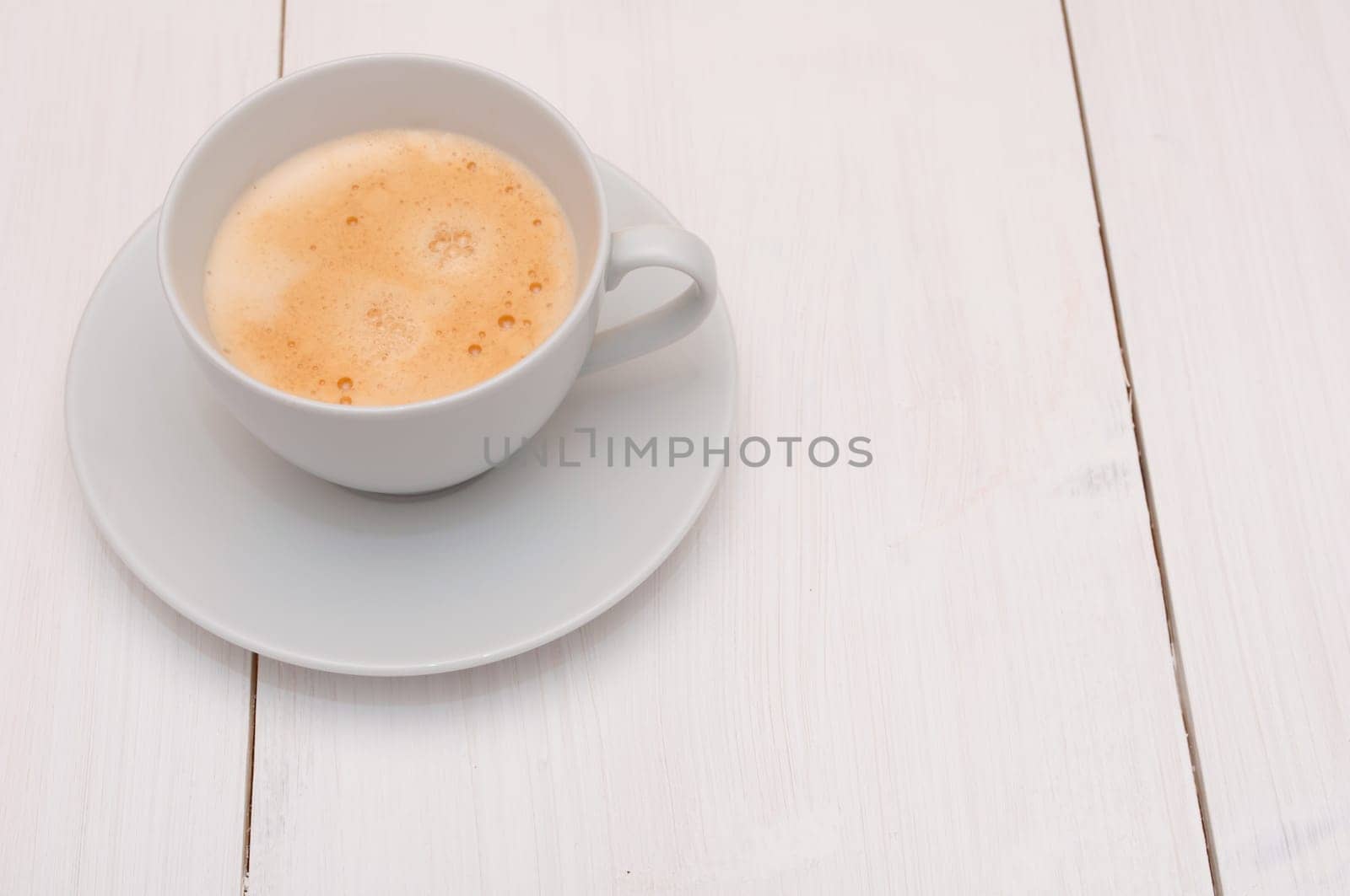 White Cup of Espresso Coffee on Wooden Table