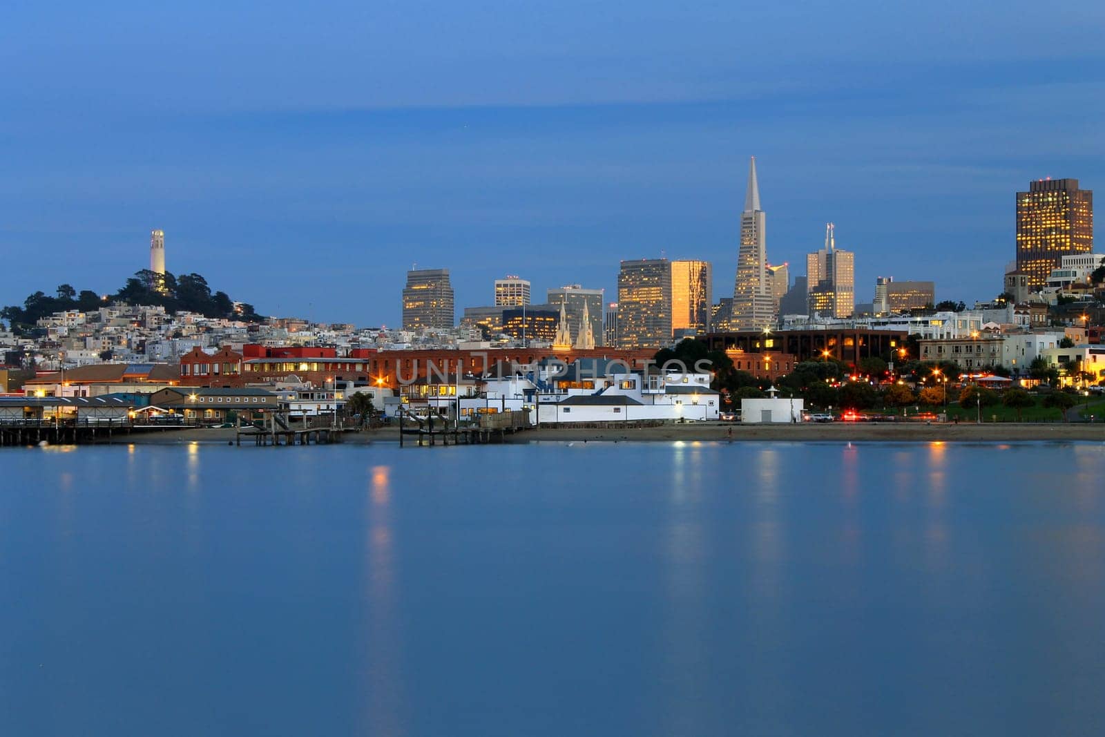 San Francisco skyline mirrored in a flat sea