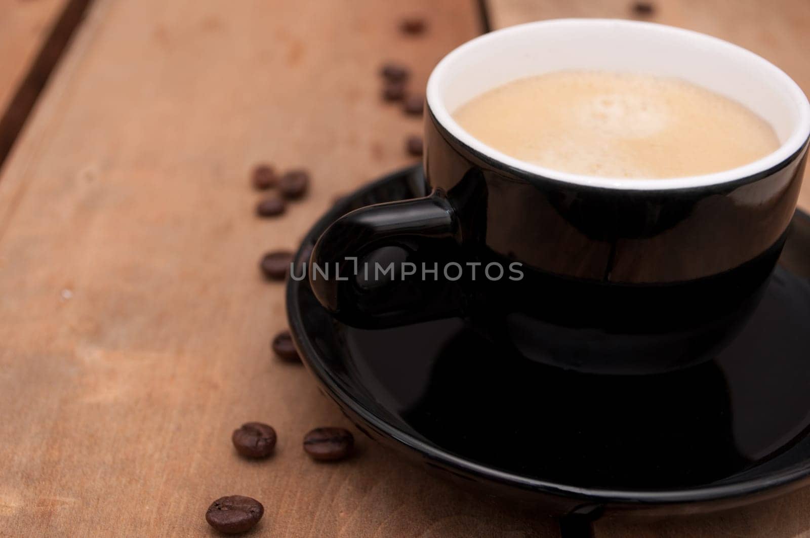 Black Cup of Espresso Coffee on Wooden Table