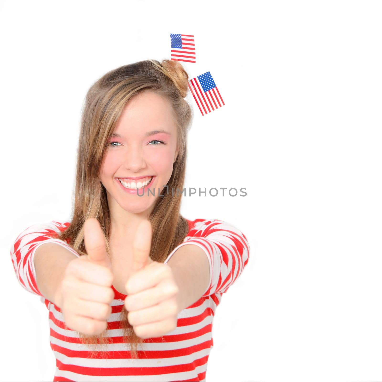 beautiful American young woman celebrating 4th of july with flag
