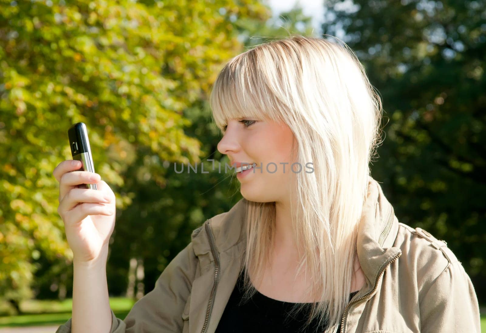 Young woman reading text message