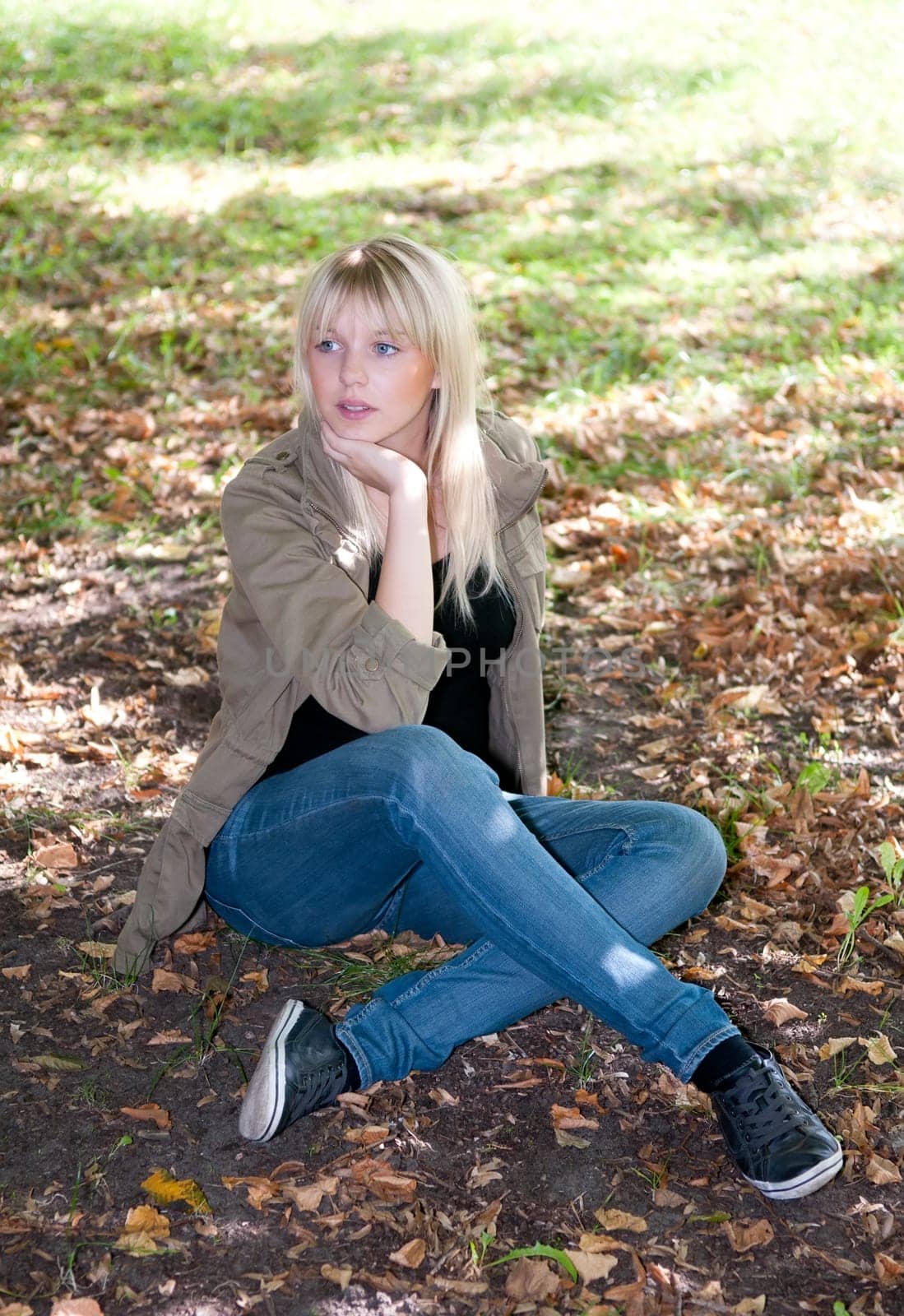 Young woman sitting on a meadow