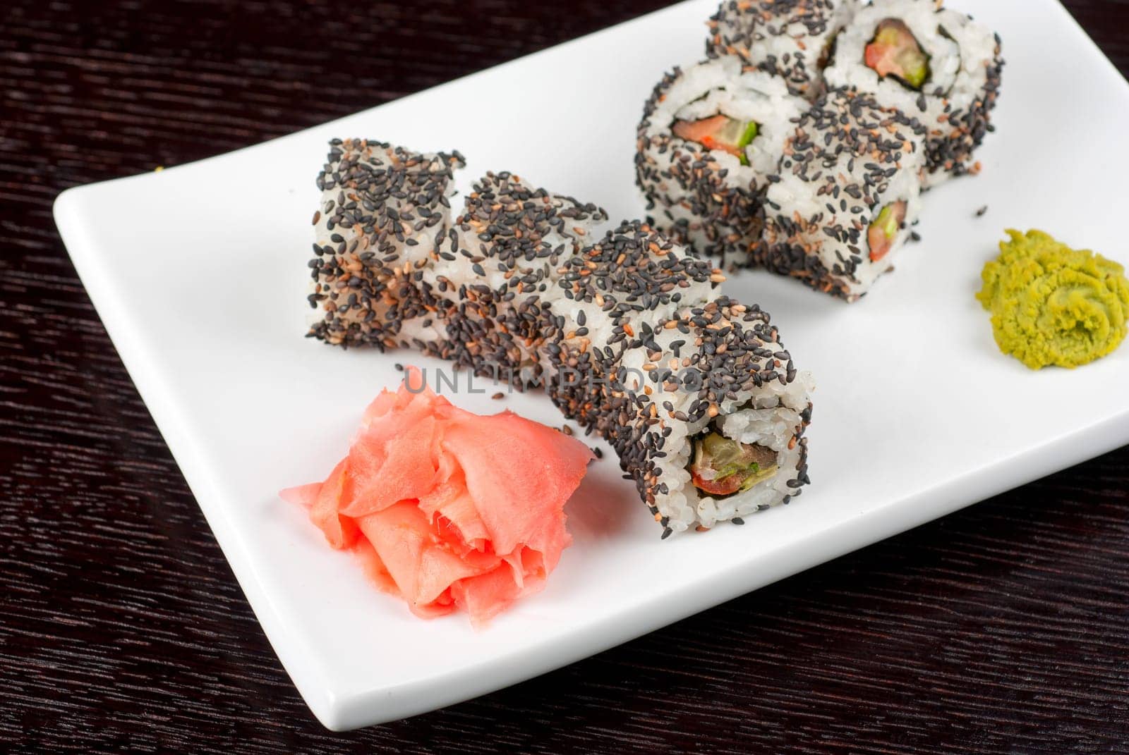 Closeup of Sushi rolls at plate with sesame