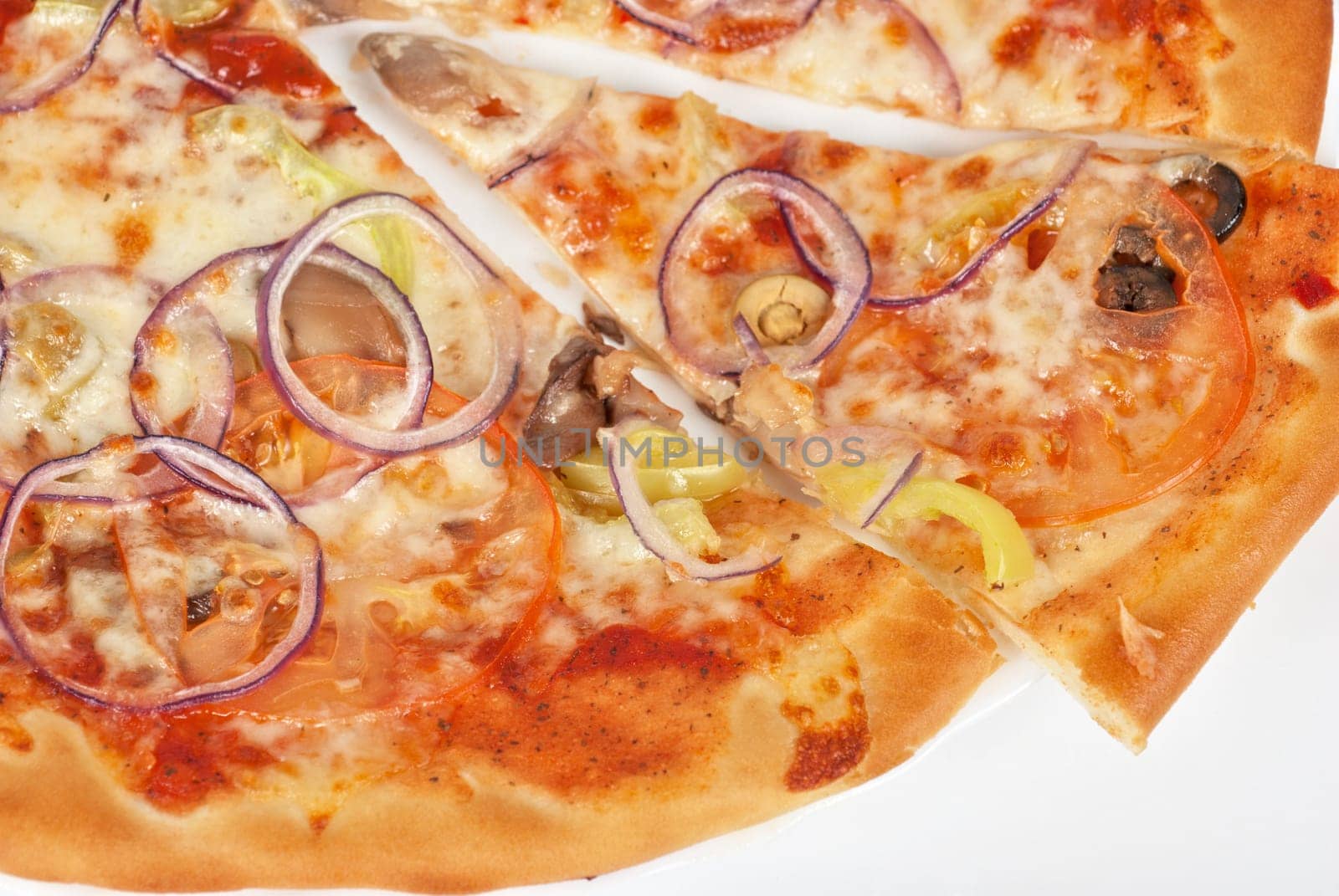 vegetable pizza closeup with tomato, Bulgarian pepper, onion, olive, champignons and mozzarella cheese