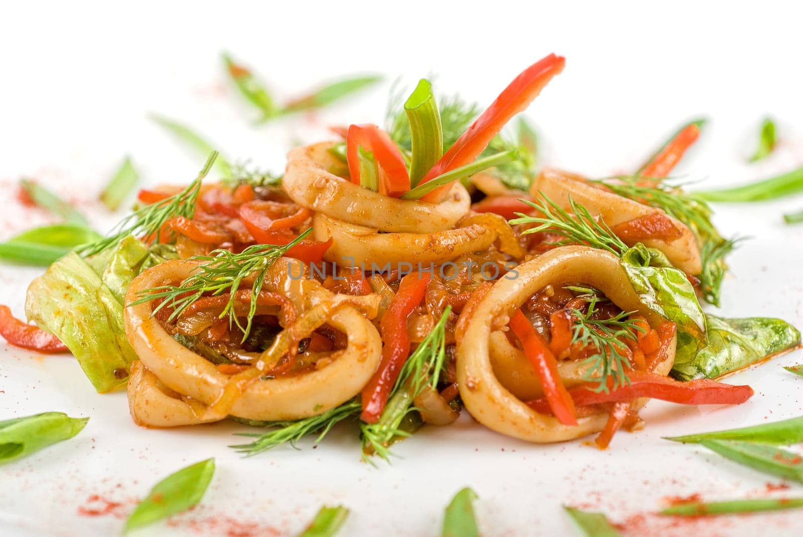 Seafood salad with squid and vegetables closeup