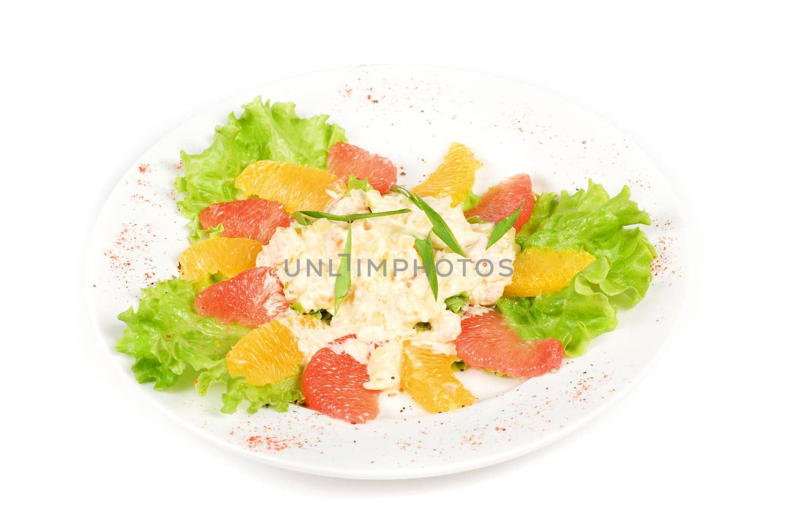 seafood salad of shrimp baked at cream with orange and grapefruit isolated on a white background