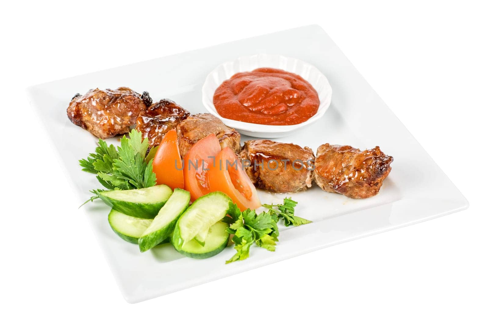 Fried kebab meat with vegetables and sauce