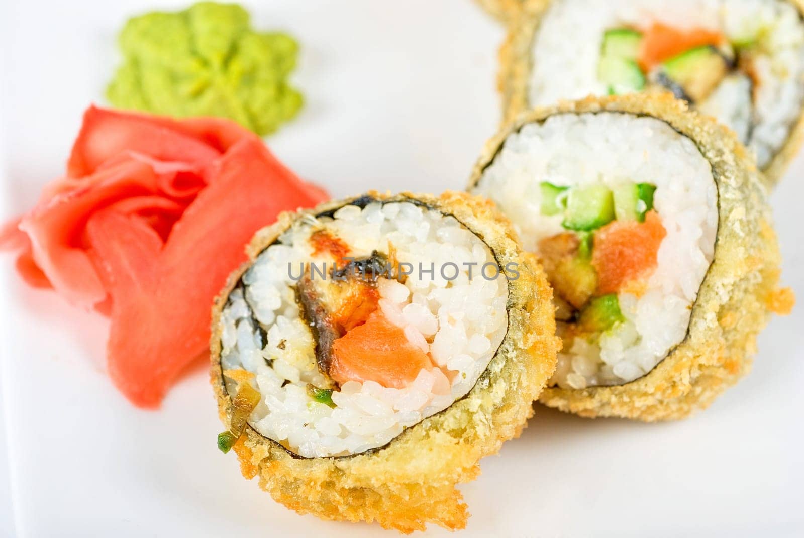 Sushi rolls at plate isolated on a white