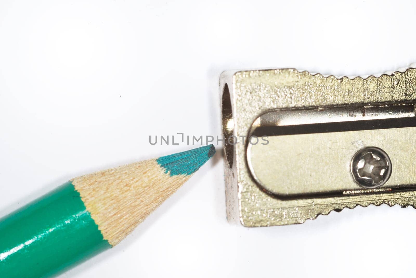 green pencil about to be sharpened