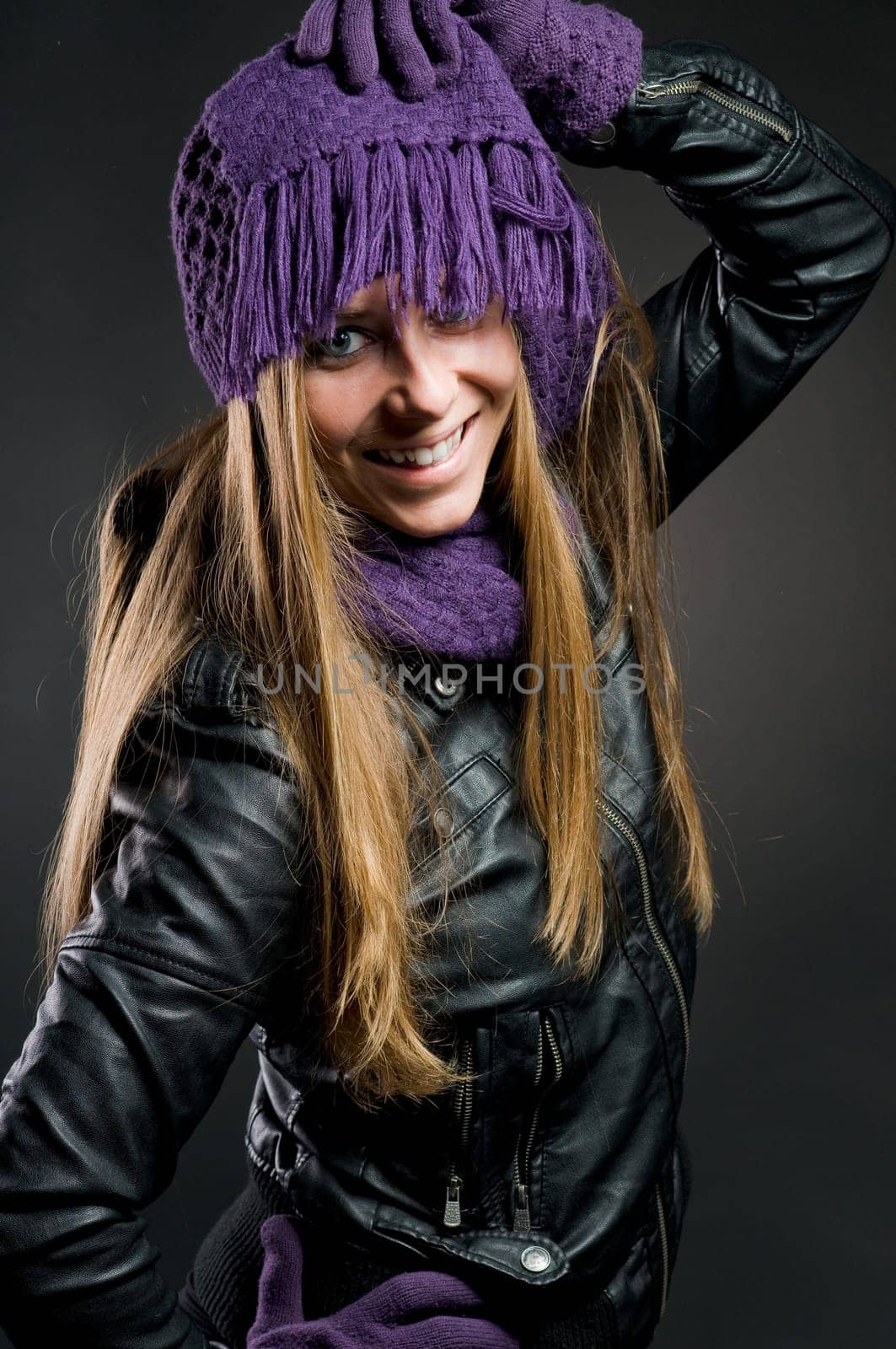 Woman with leather jacket,hat,scarf and gloves