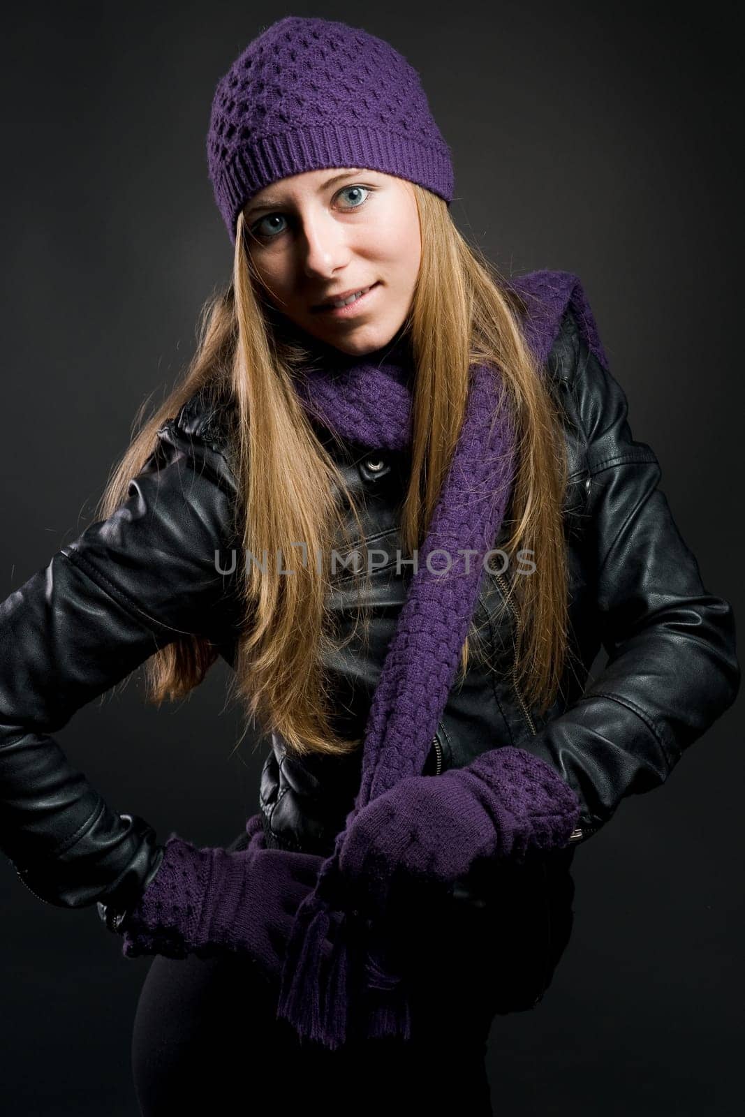 Woman with leather jacket,hat,scarf and gloves