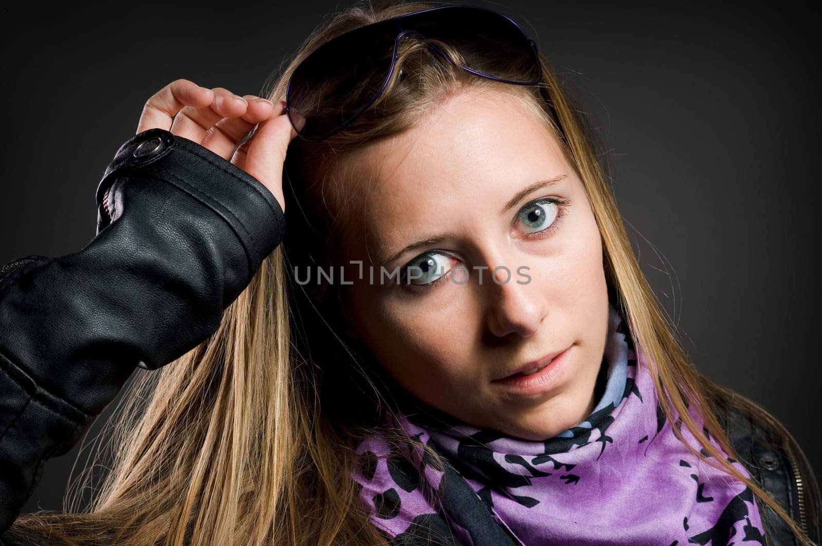 Sexy portrait of a woman with beautiful brown long hair and glasses
