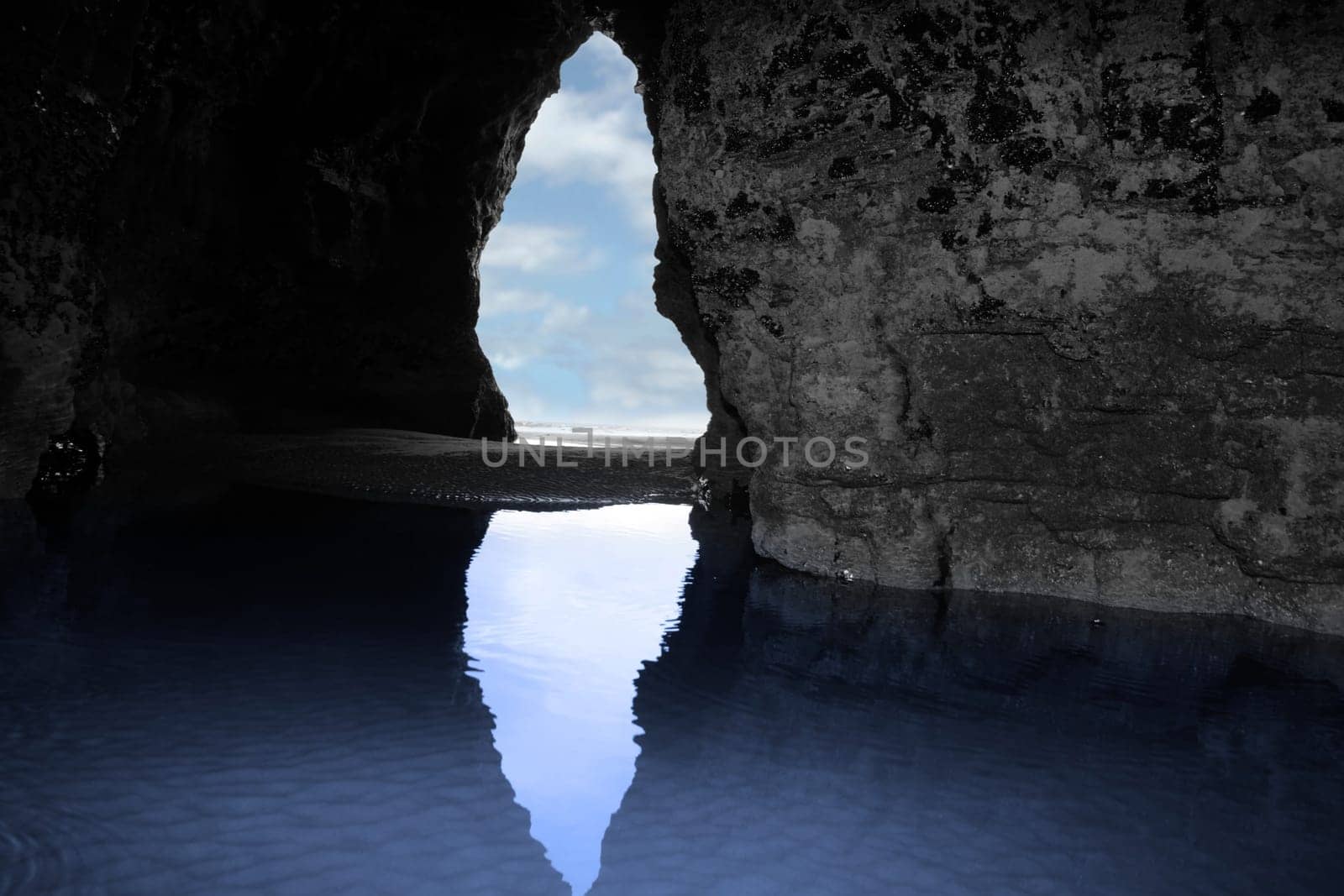 a view from the inside of a beach cave looking out at the sea